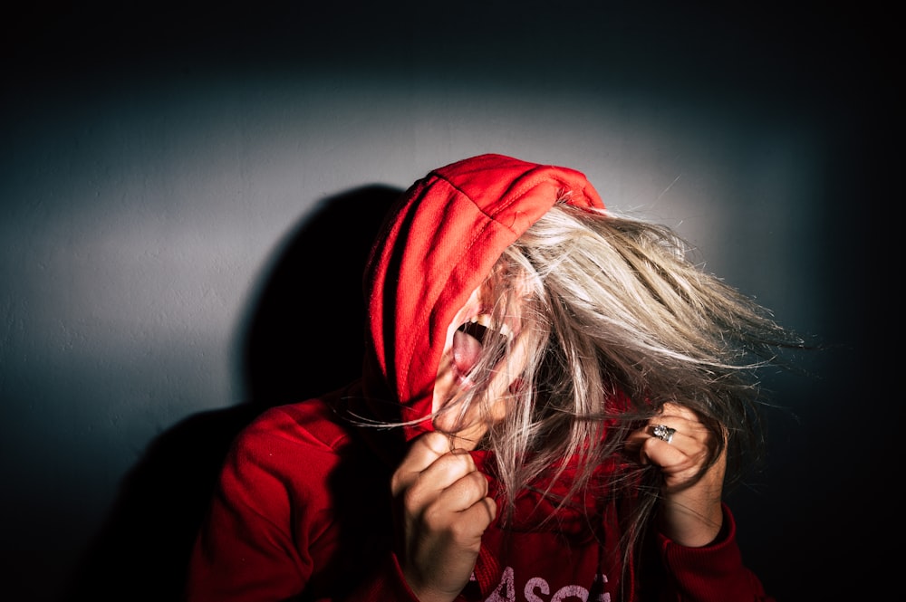 person wearing red hoodie