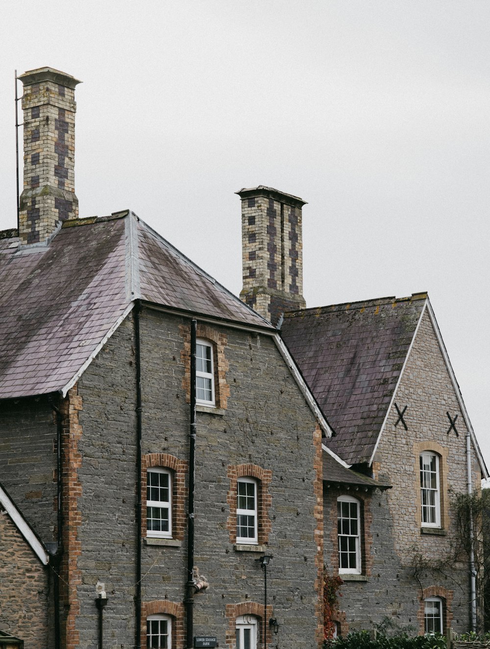 two gray stone houses