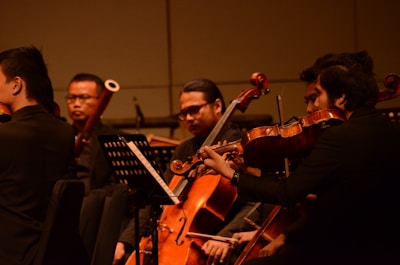 group of people playing musical instruments close-up photography