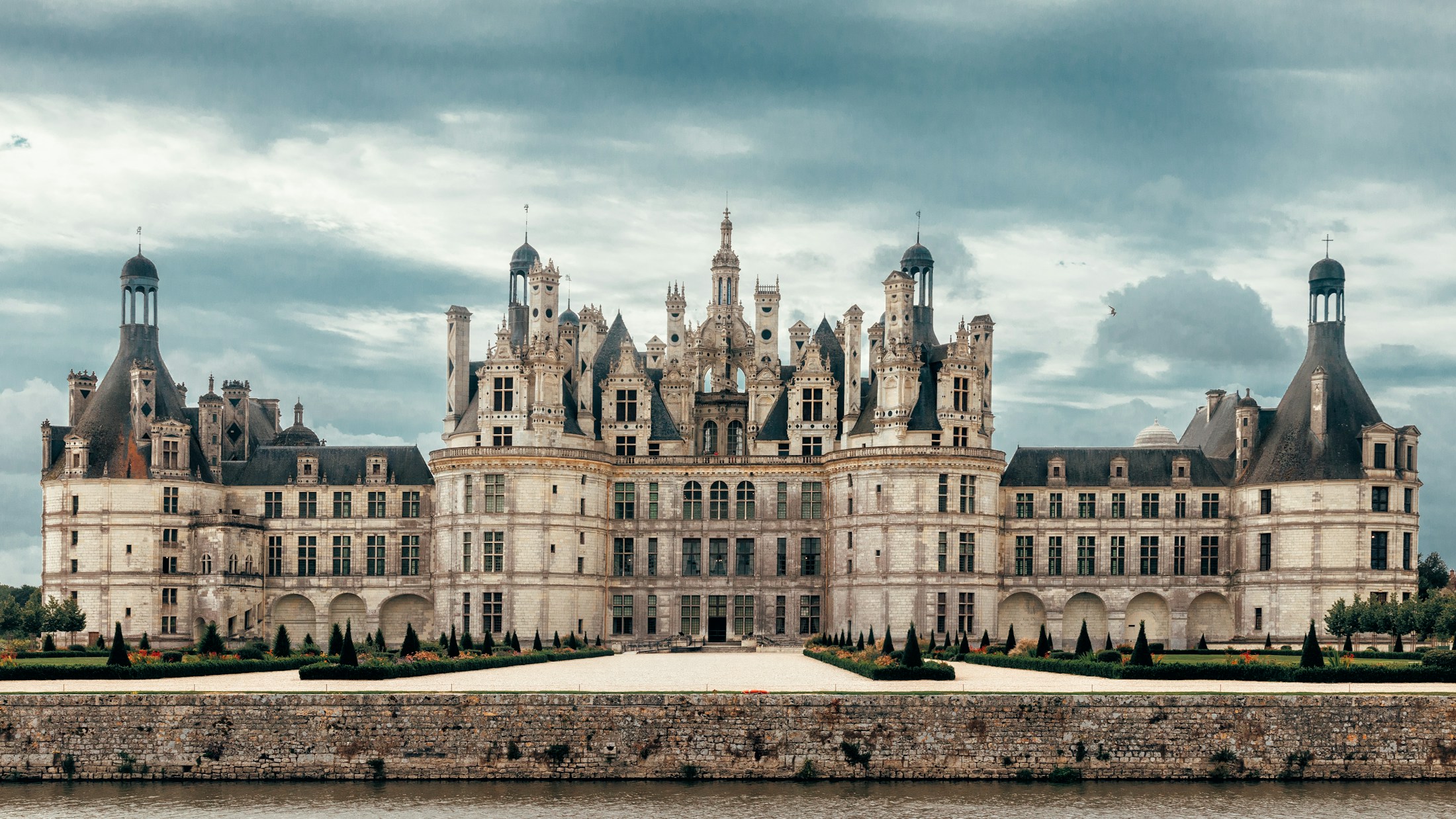 A chateau at the end of a long approach at dusk