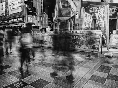 Black-and-white candid street shot highlighting vibrant urban life.