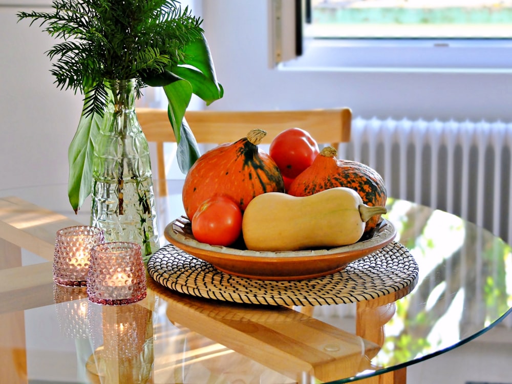 several pumpkins in a plate