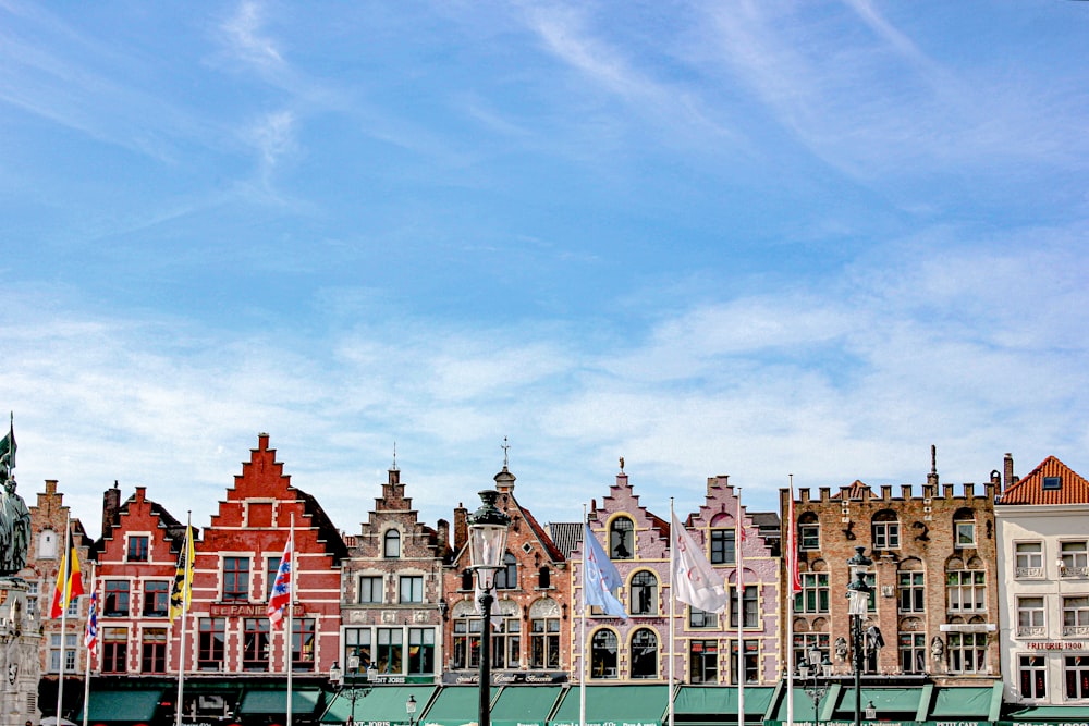 brown painted buildings under blue sky