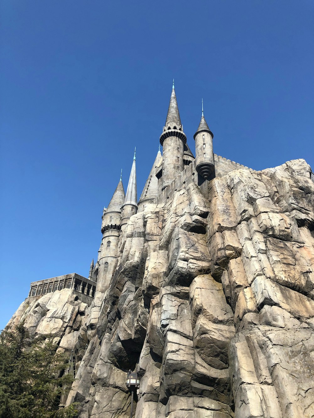 gray concrete castle on cliff during daytime