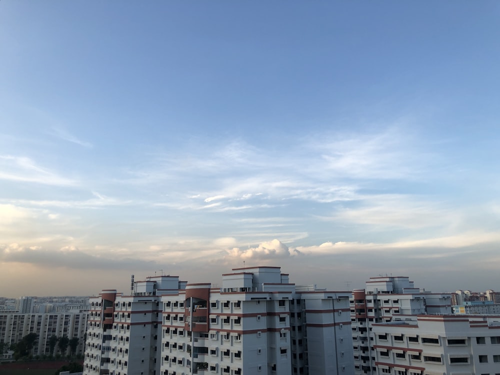 white and red concrete buildings under white sky