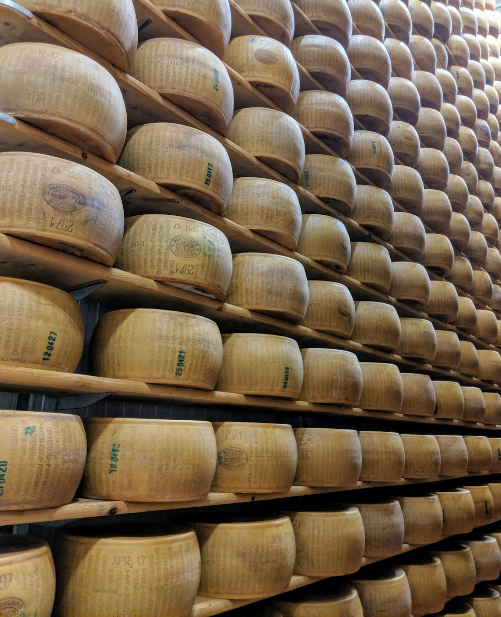 round beige wooden containers on shelf