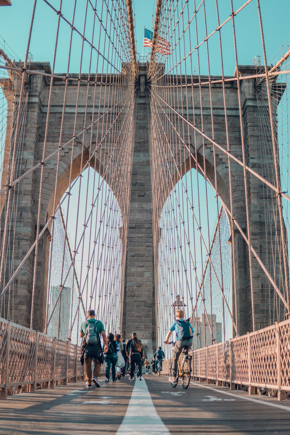people on Brooklyn Bridge during daytime