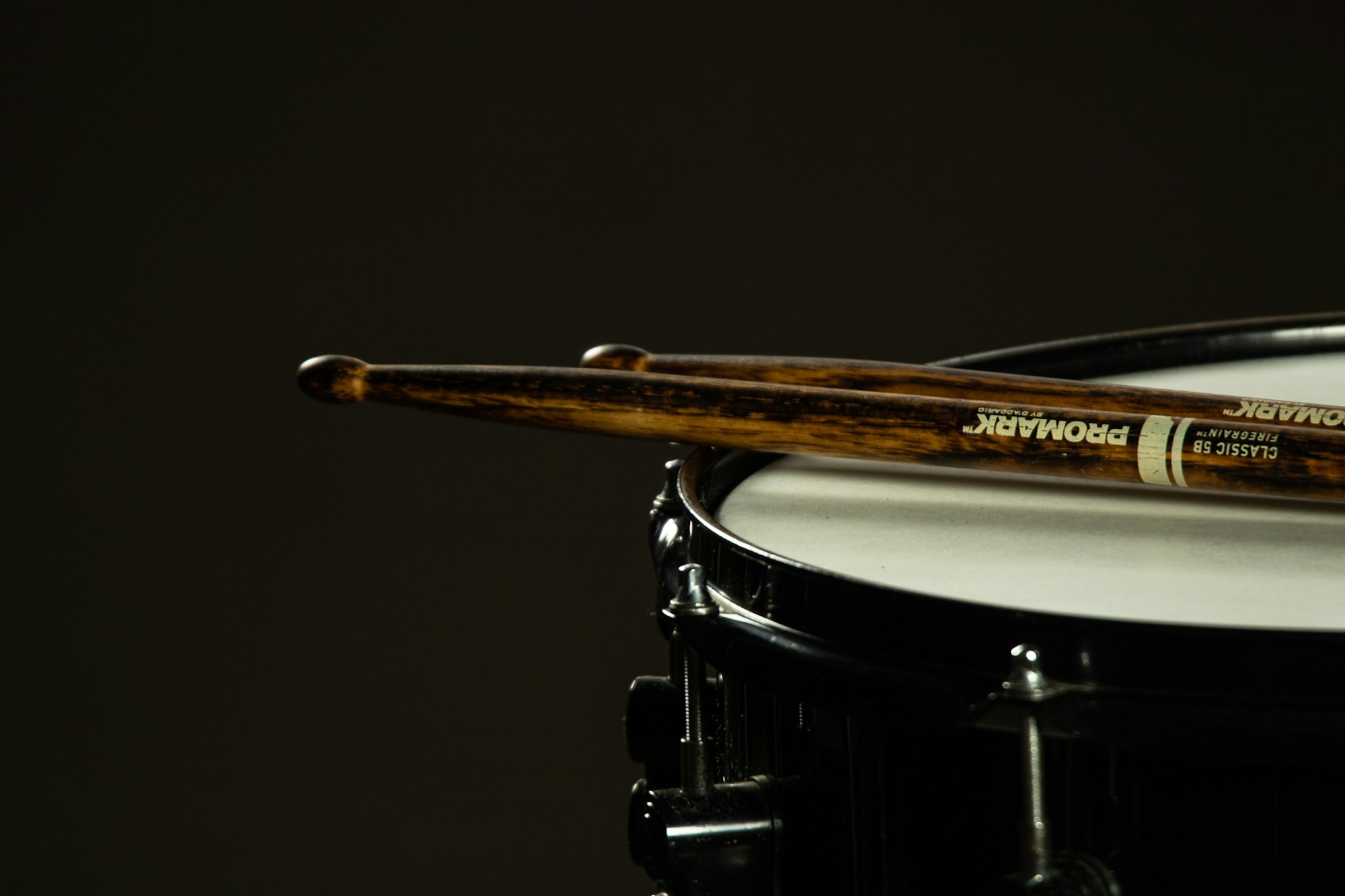 Drumsticks on a snare drum.