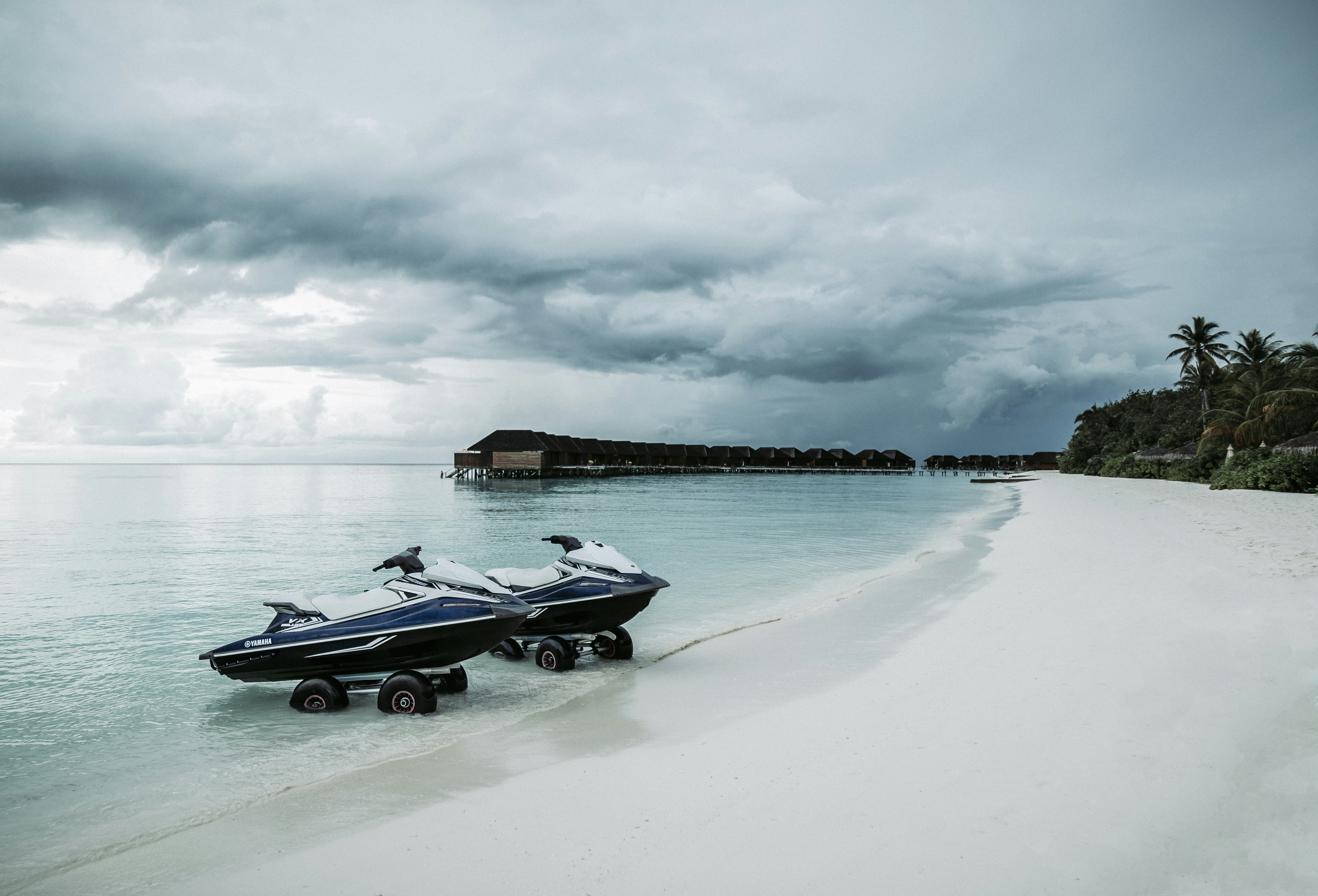 blue-and-white personal watercraft on shore