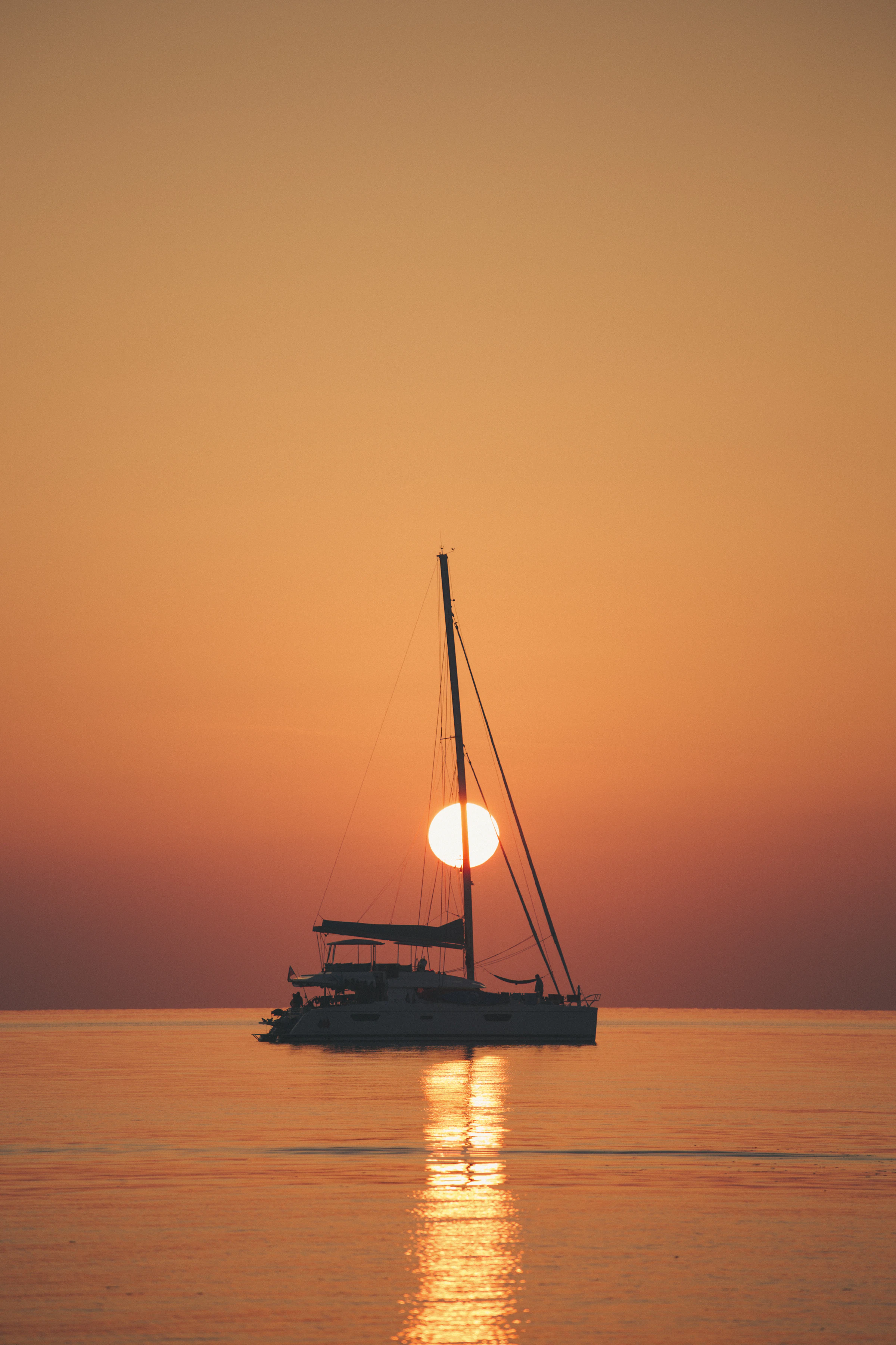 Two guests alone on the bow at sunset
