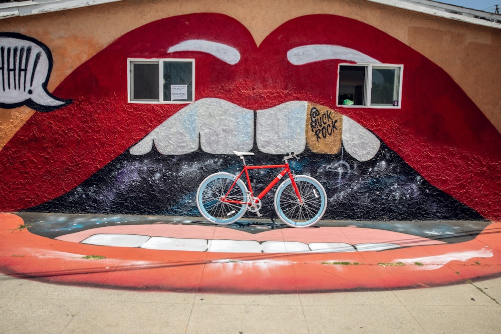 red and white mountain bike painting