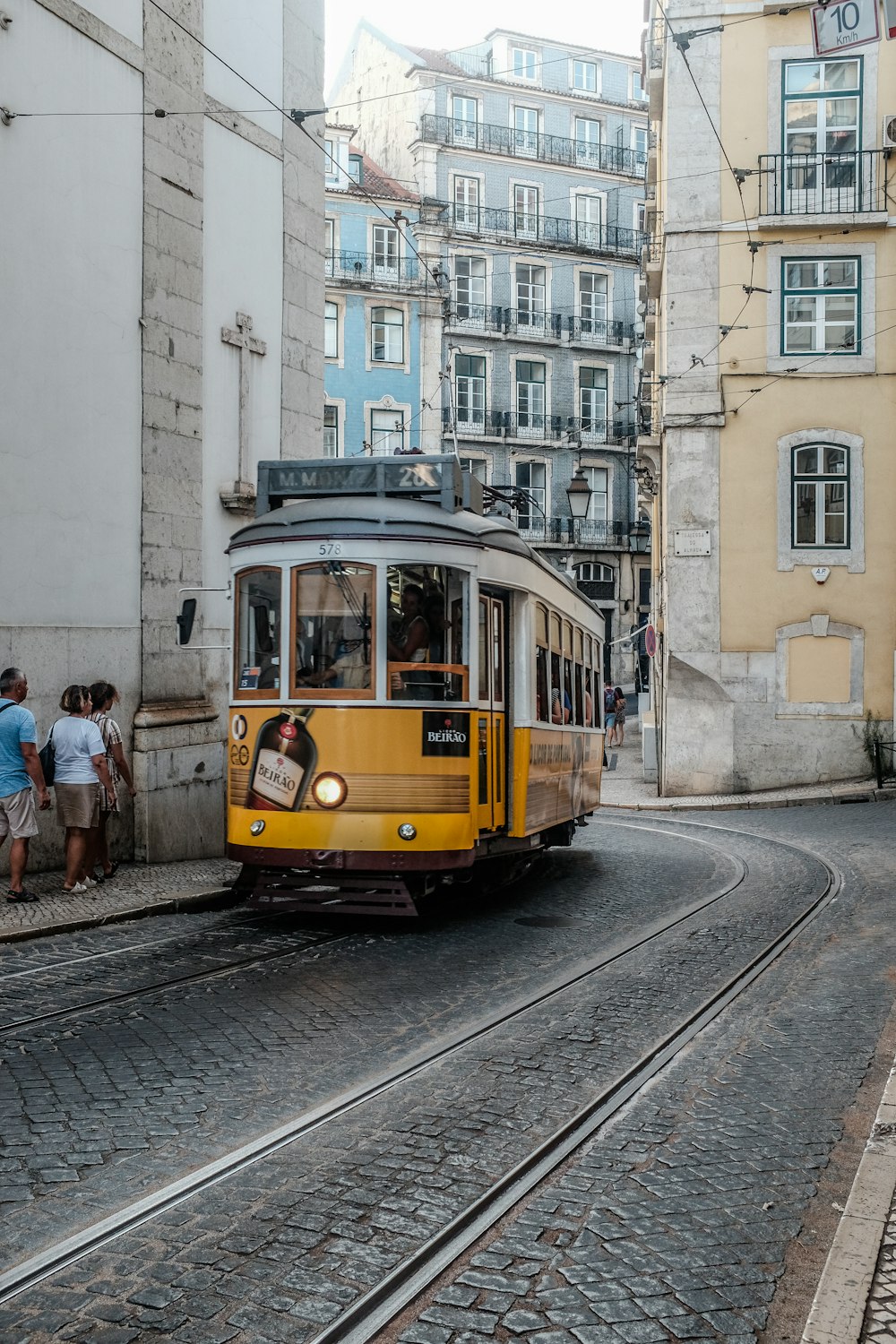 yellow and white tram during daytime