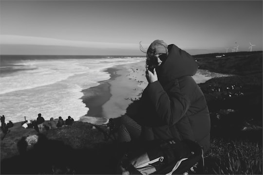 grayscale photo of person wearing hoodie in Peniche Portugal