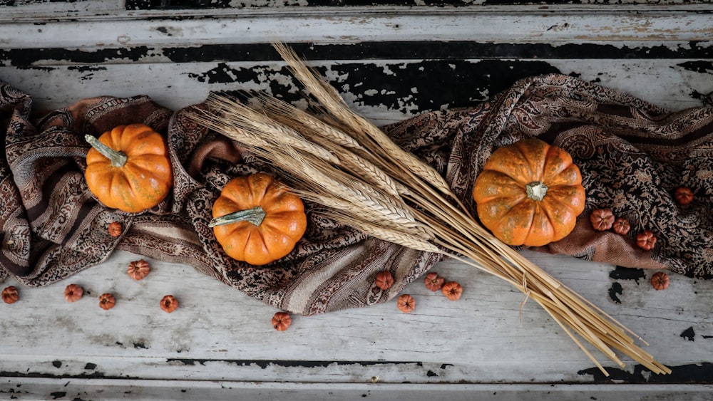 three orange pumpkins