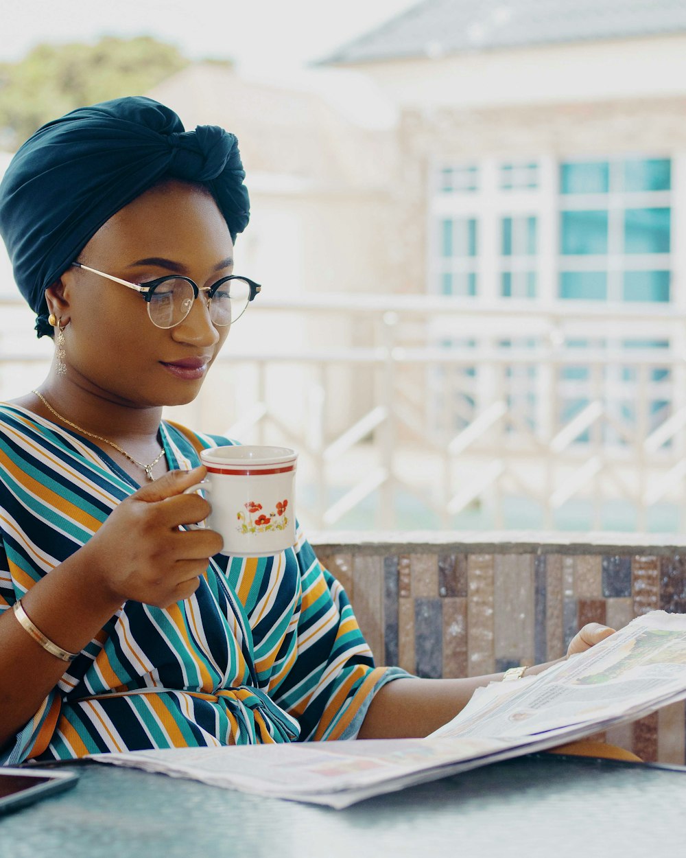 woman holding ceramic mug