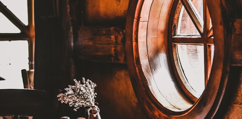 flower vase beside window