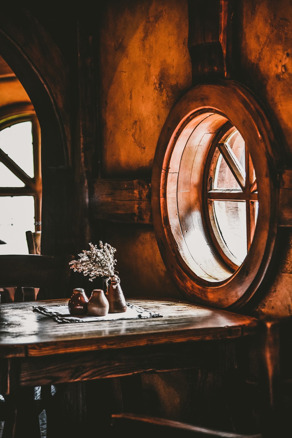 flower vase beside window