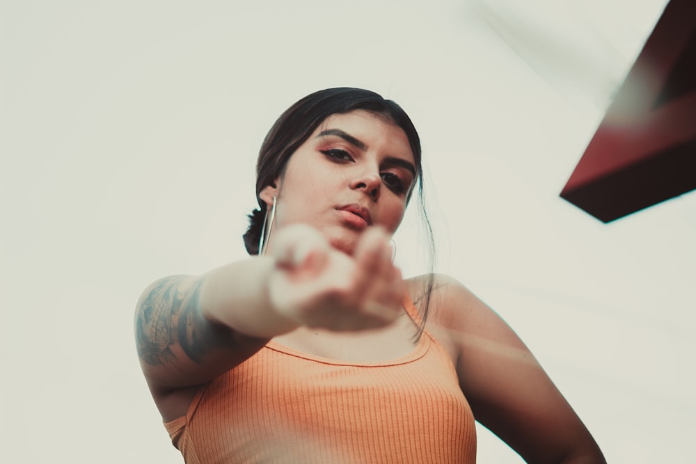 woman in orange tank top