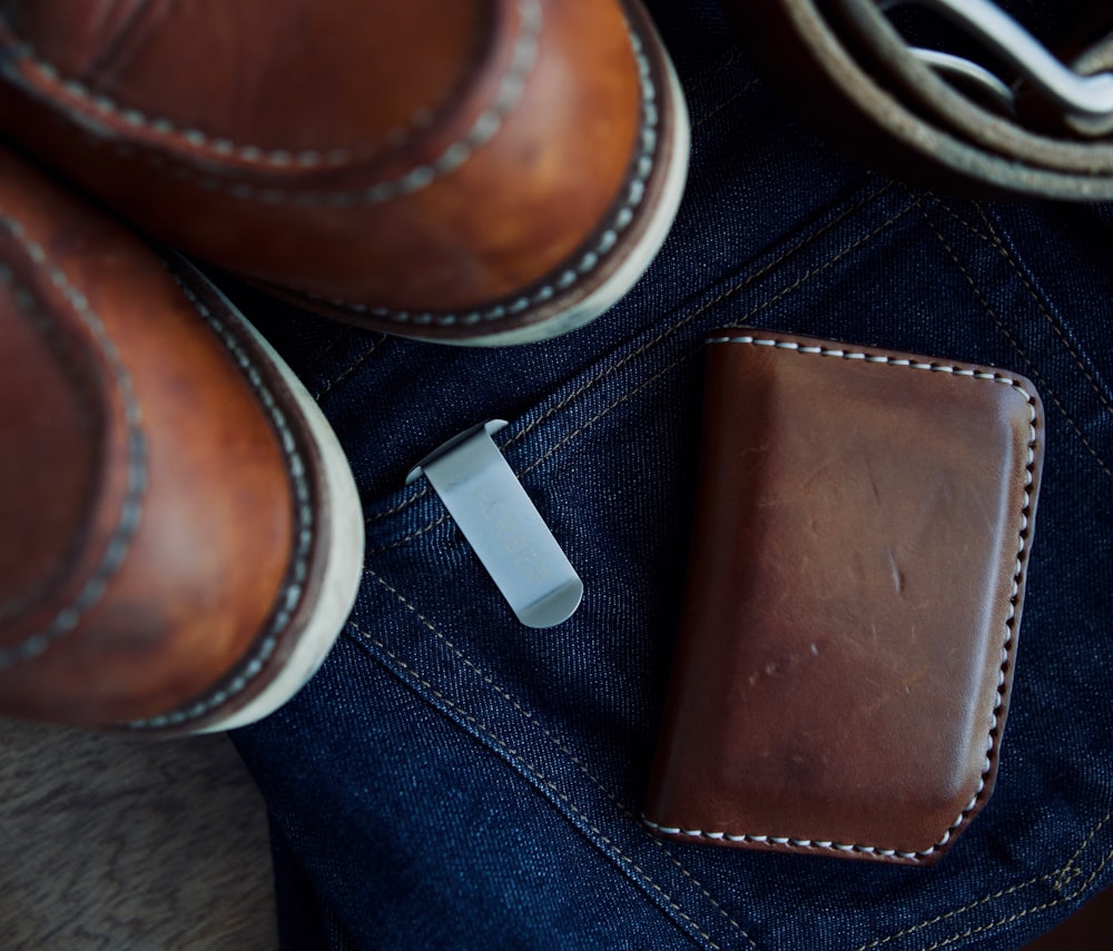 brown leather wallet on denim bottoms