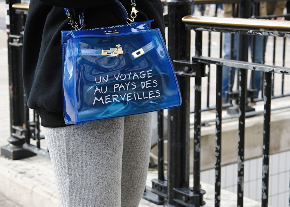 blue and black leather tote bag