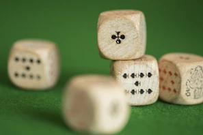 Close-up of a custom wooden organizer holding colorful game cards and dice on a gaming table