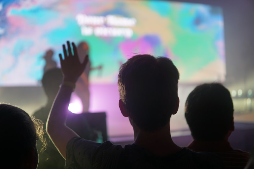 people standing near stage