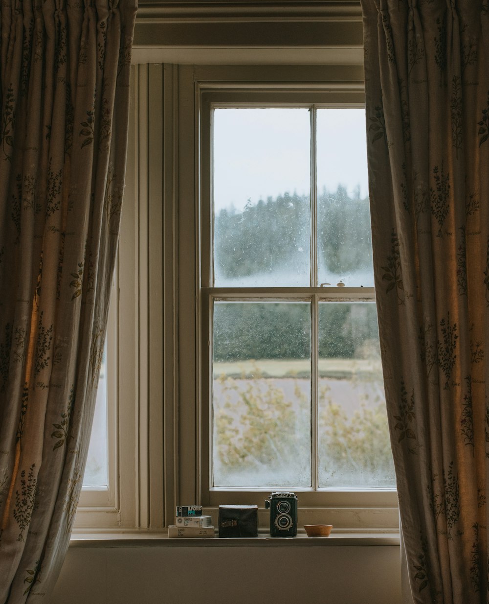 white wooden framed glass window