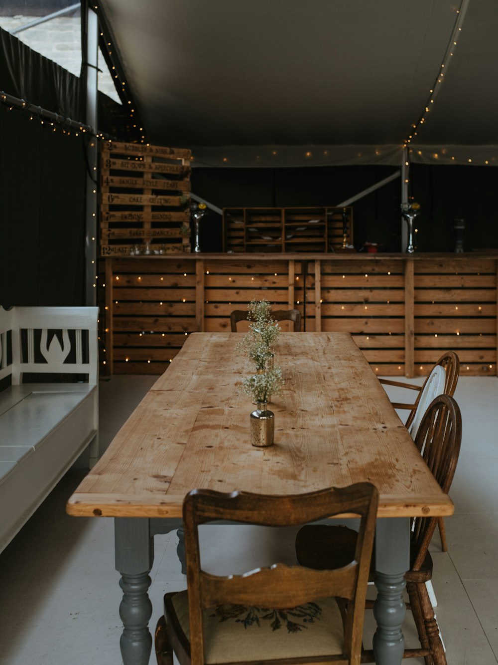 rectangular brown wooden dining table with chairs