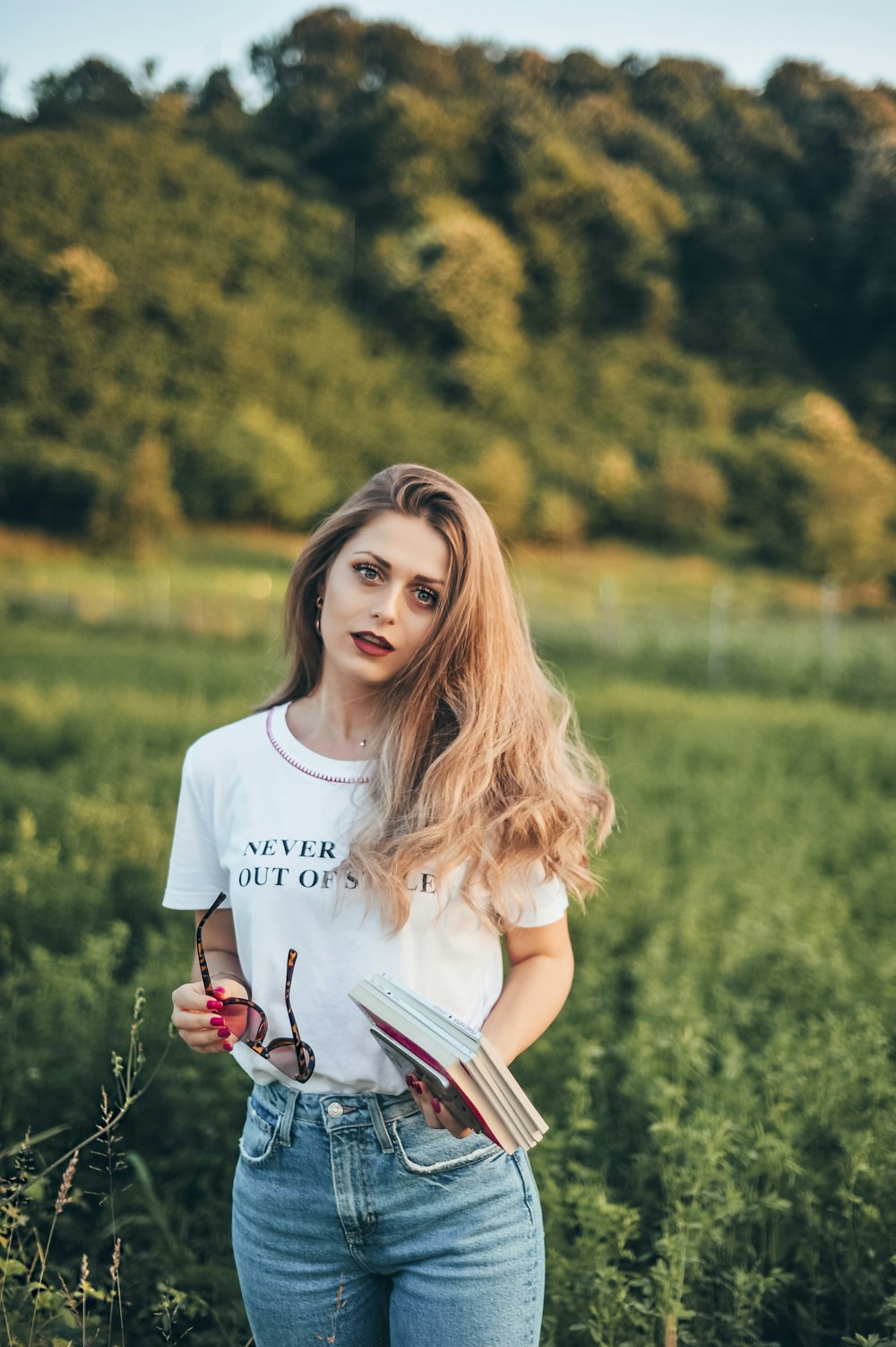 woman holding book lot