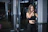 woman standing in front of exercise equipment