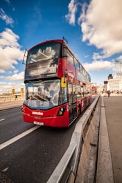 red and black bus on road