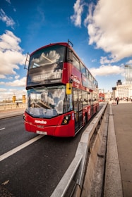 red and black bus on roa