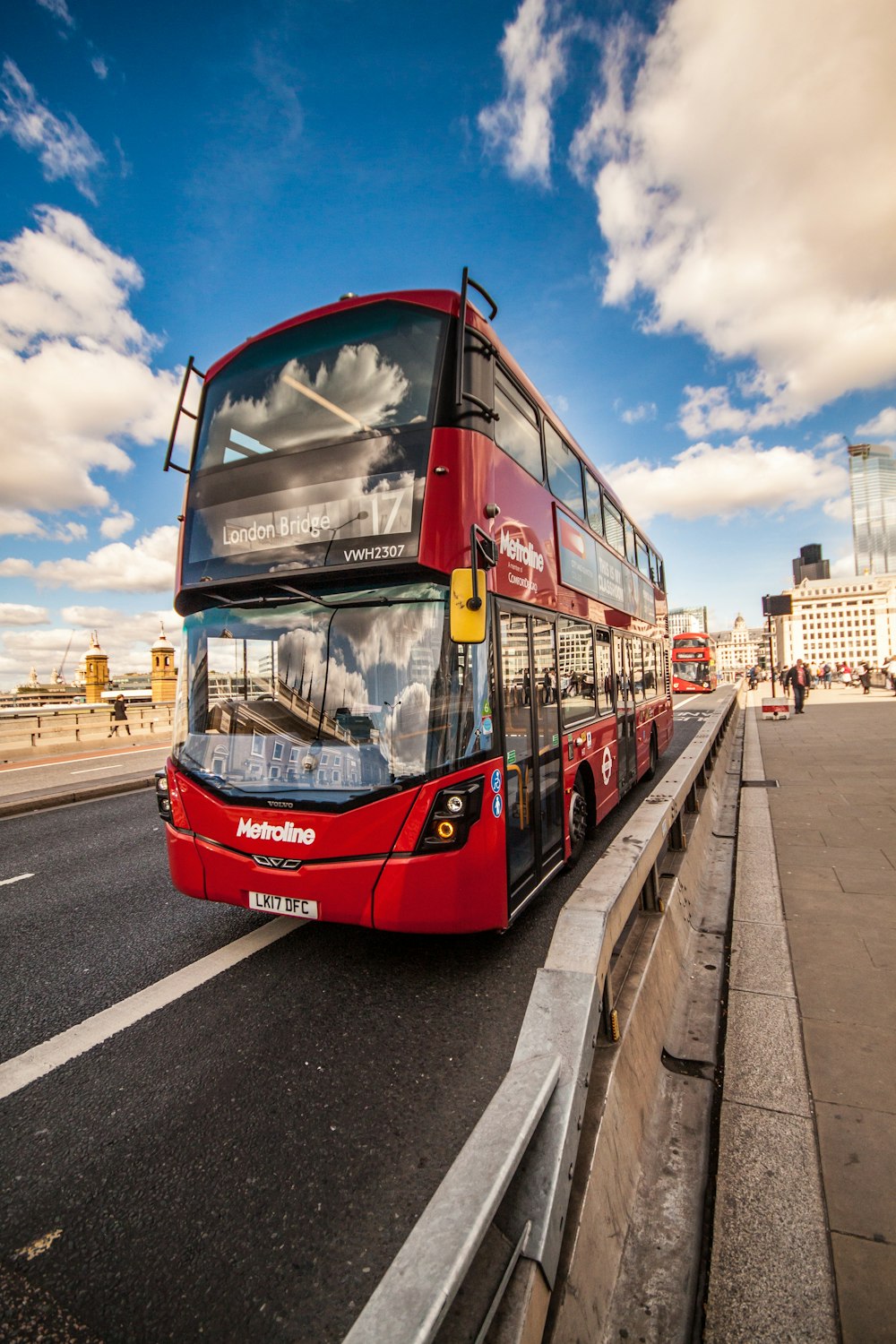 red and black bus on roa