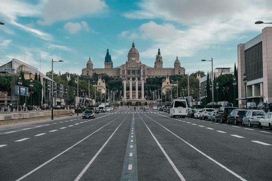 wide road with vehicles in Museu Nacional d'Art de Catalunya Spain