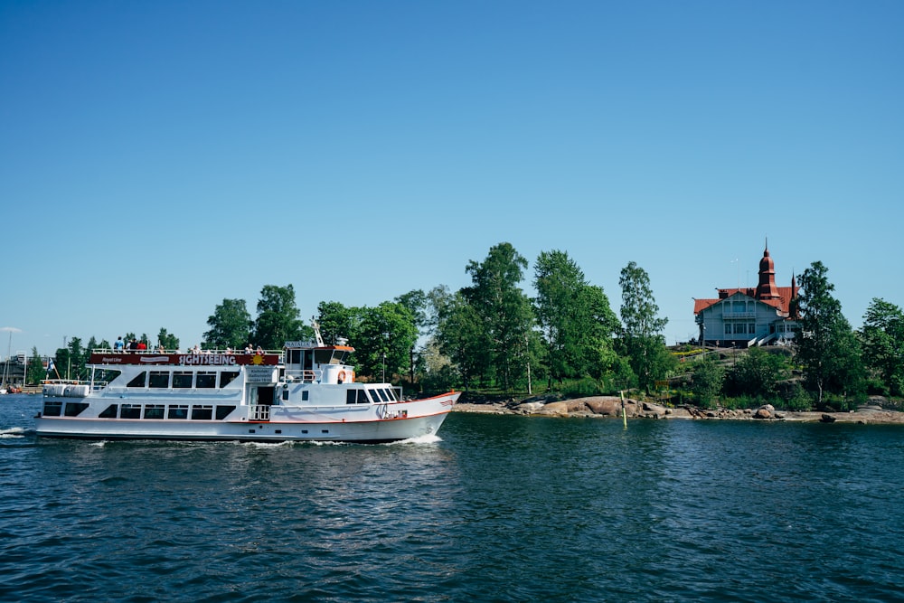 white cruise ship on body of water during daytime