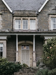 Charming house facade with stone details and a wooden door