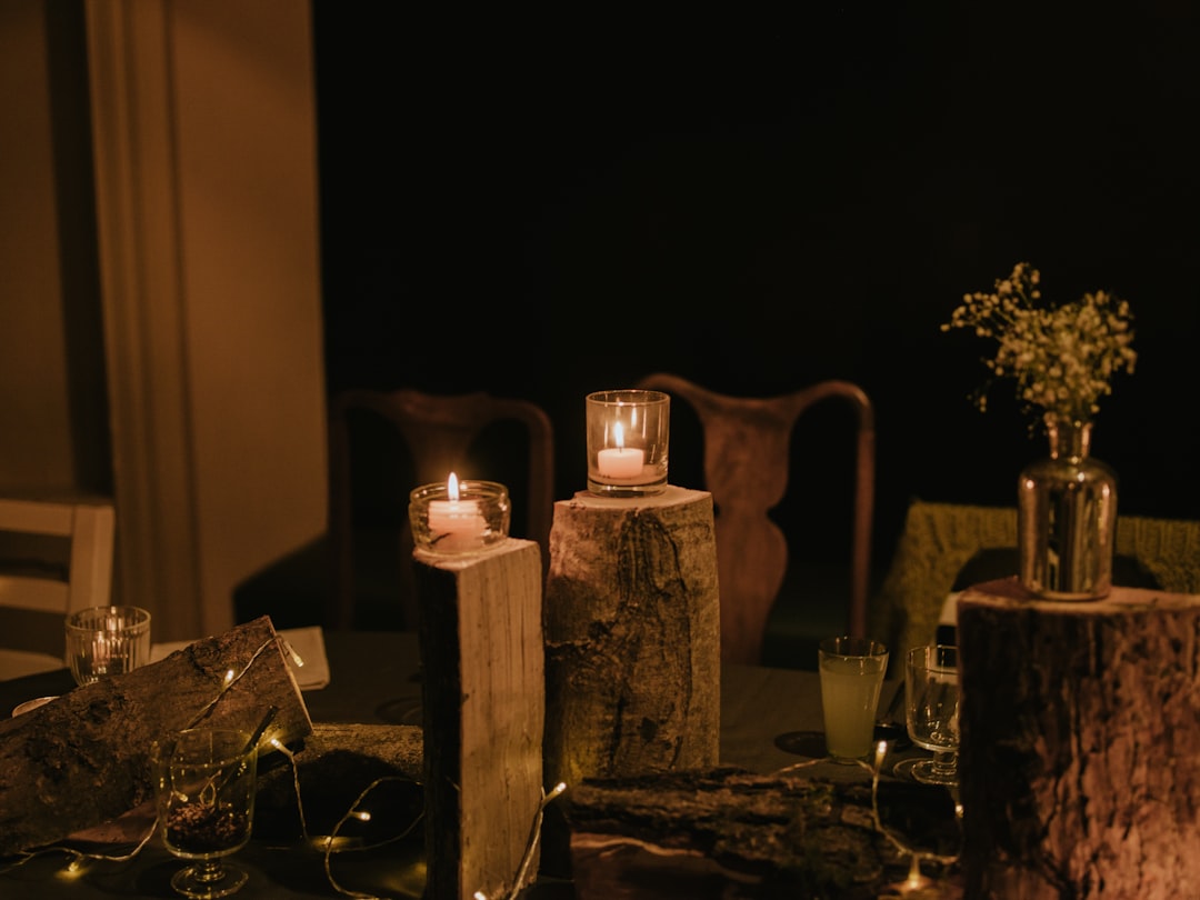 brown wooden candle holder with pillar candle