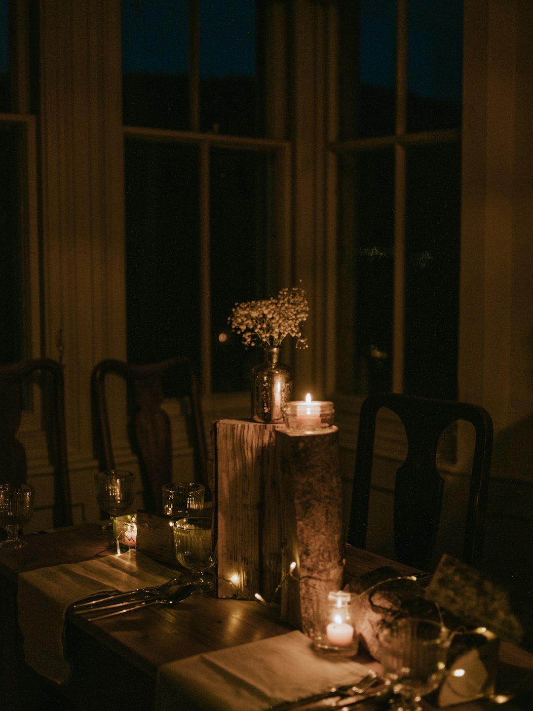 lighted tealight candle on dining table