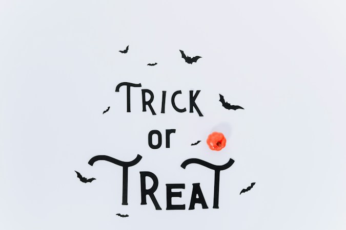 Trick or Treat sign with Halloween decorations, a reminder to check registration for Henderson's October recreation center events