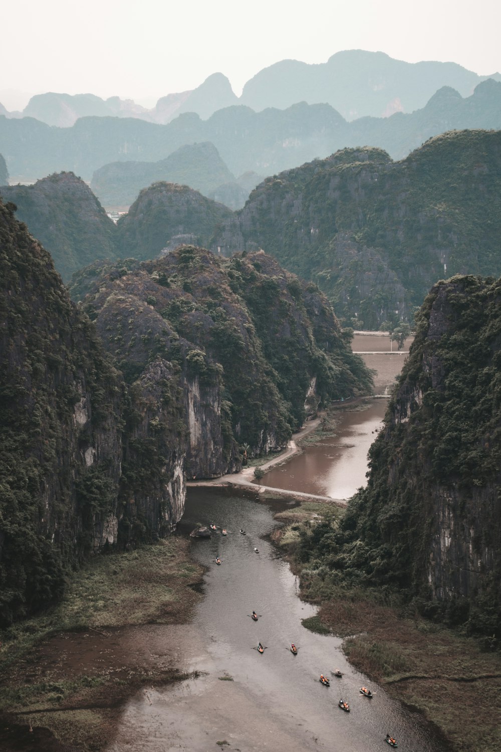 a river running through a lush green valley