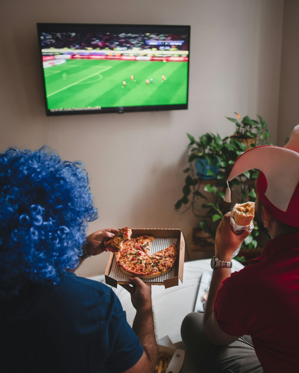 two person watching TV