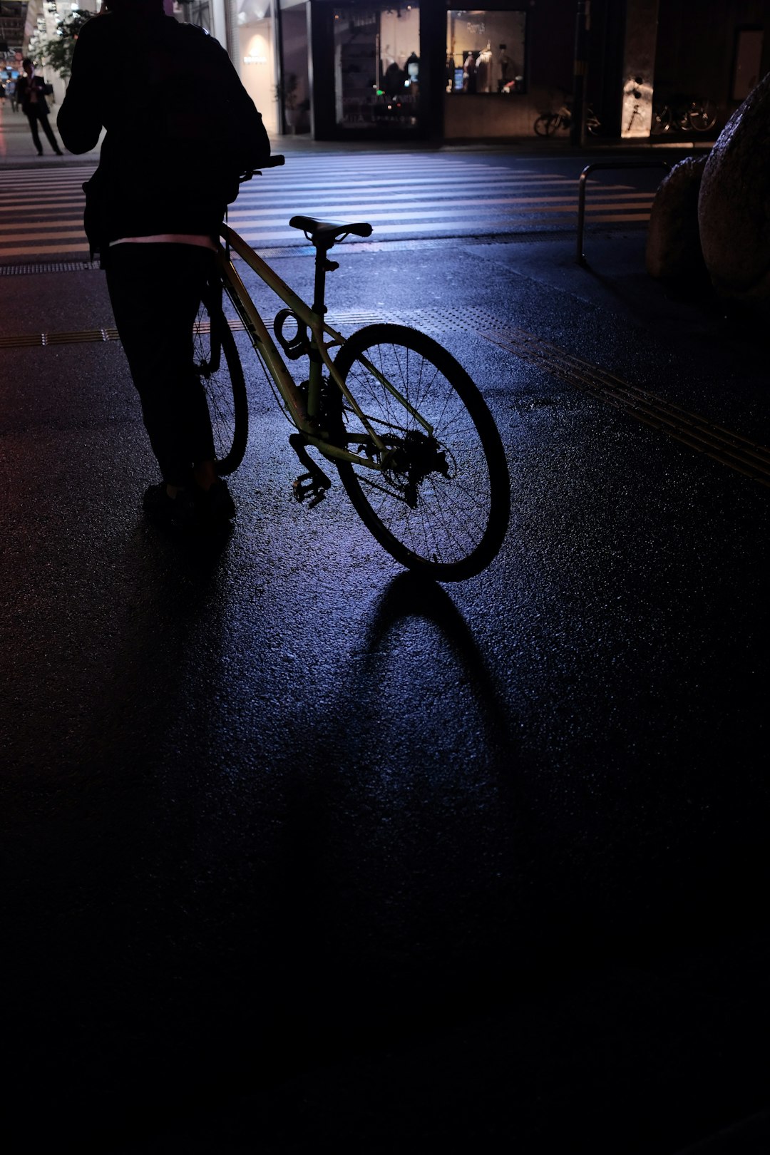 man walking with his bicycle