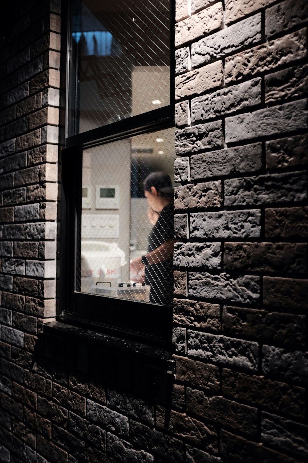 man standing near the window