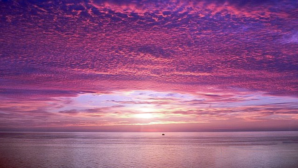 calm body of water during daytime