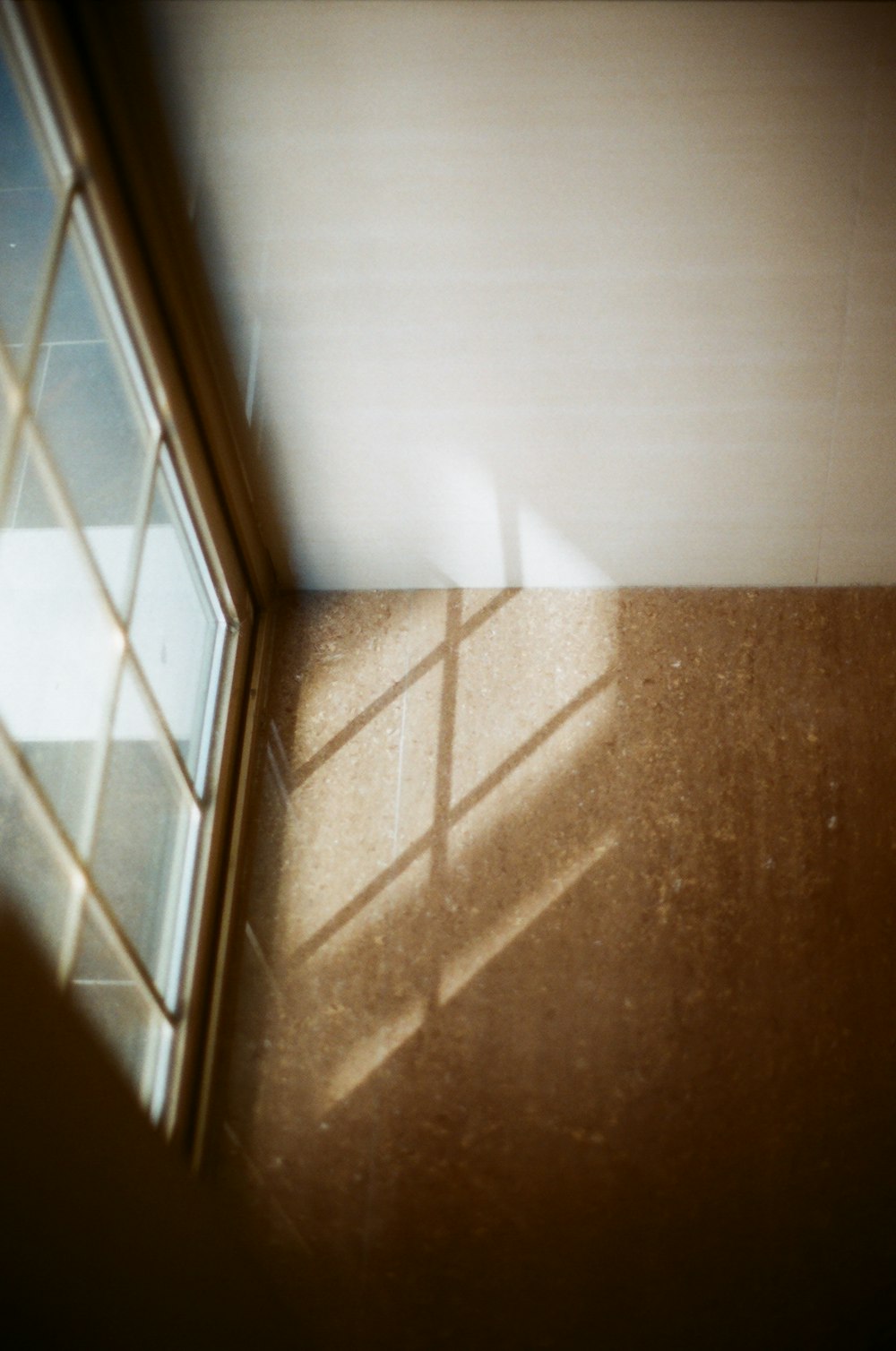 the shadow of a window on a wall