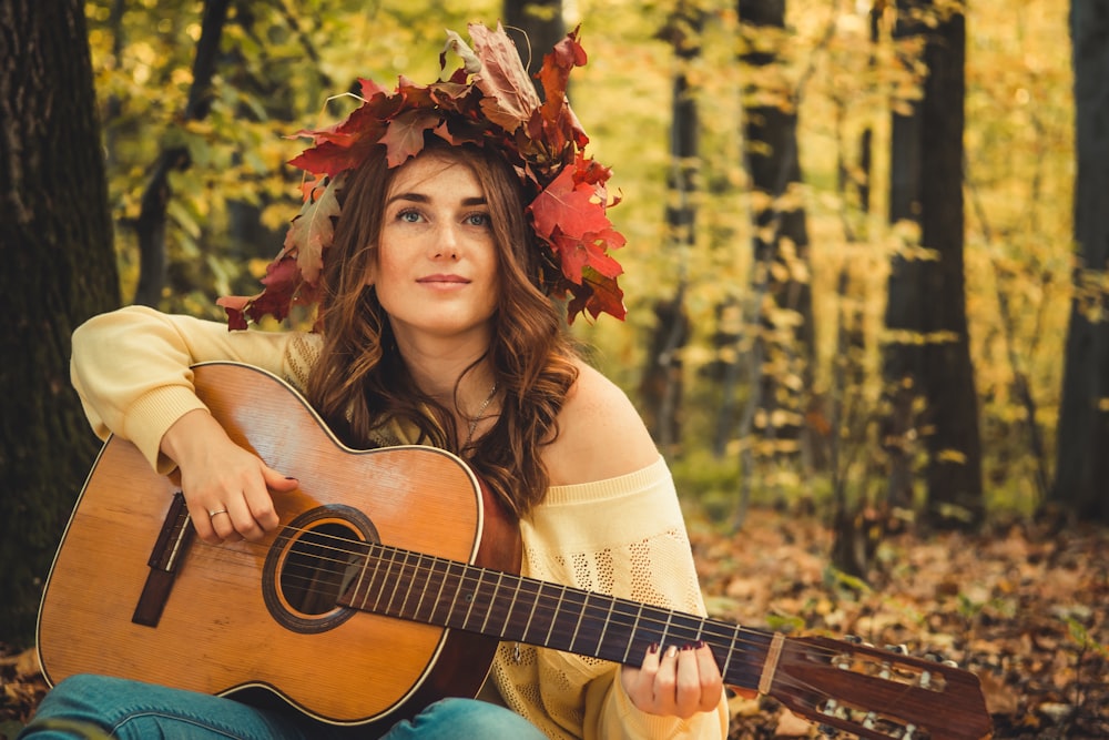 woman playing acoustic guitar