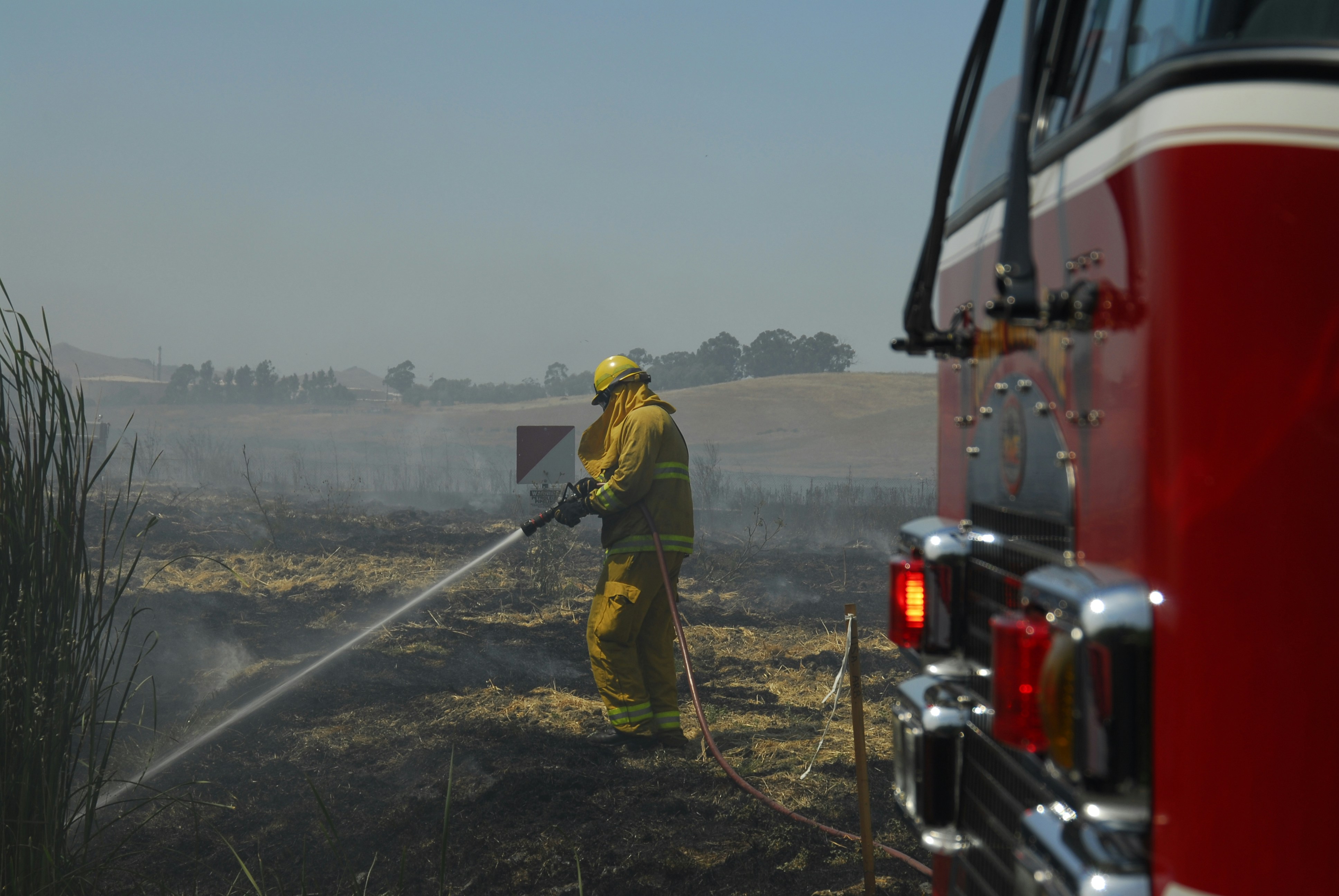 firefighters water tank truck farmland