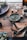 Close-up of agricultural supplies neatly arranged on a wooden table in a rustic setting.