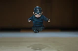 An athlete mid-action captured perfectly in a 3D printed figurine, showcasing dynamic movement.