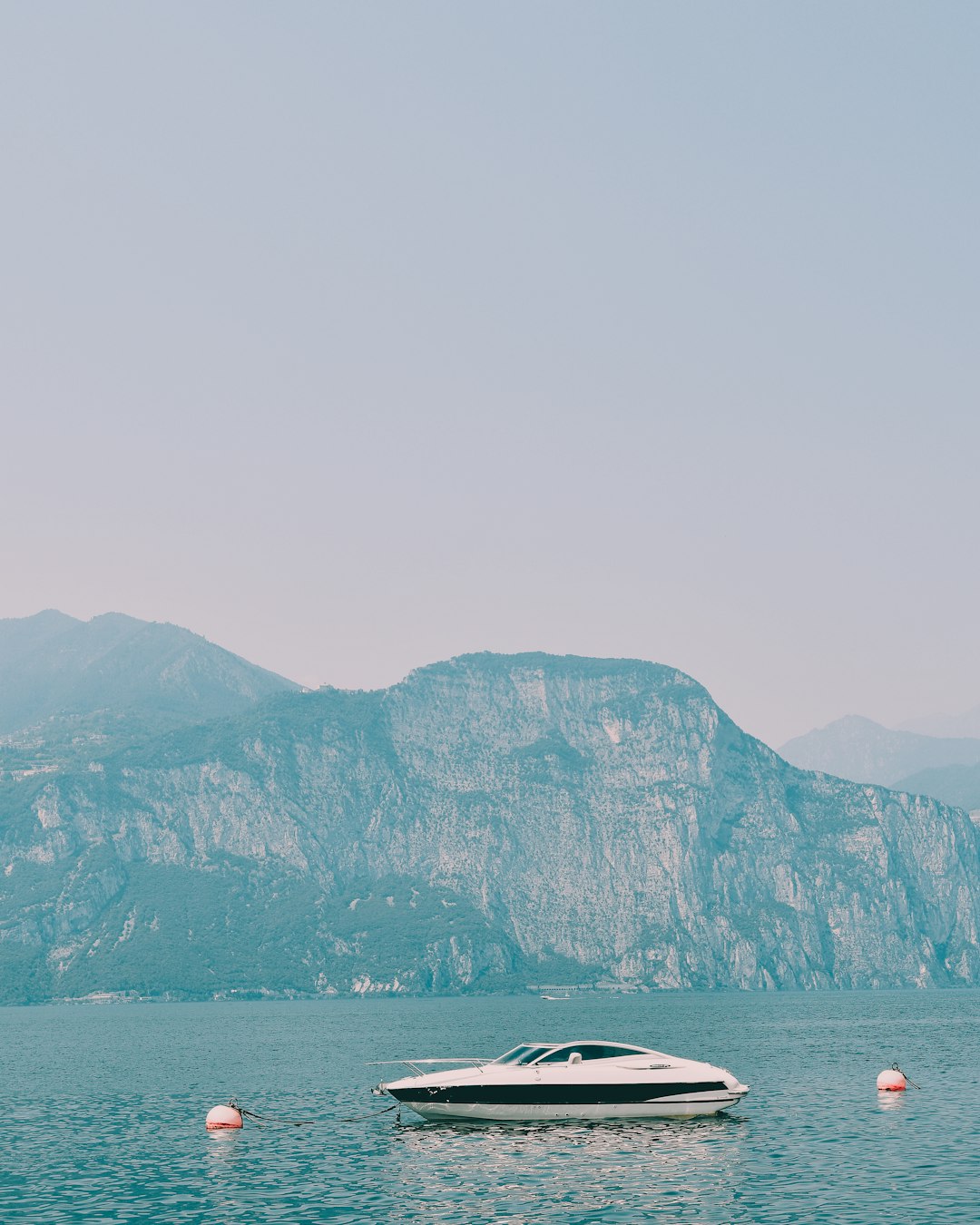 white and black motor boat